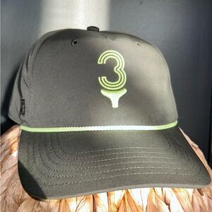 Adidas Tee Time 5-Panel Hat in black with a green logo and rope detail